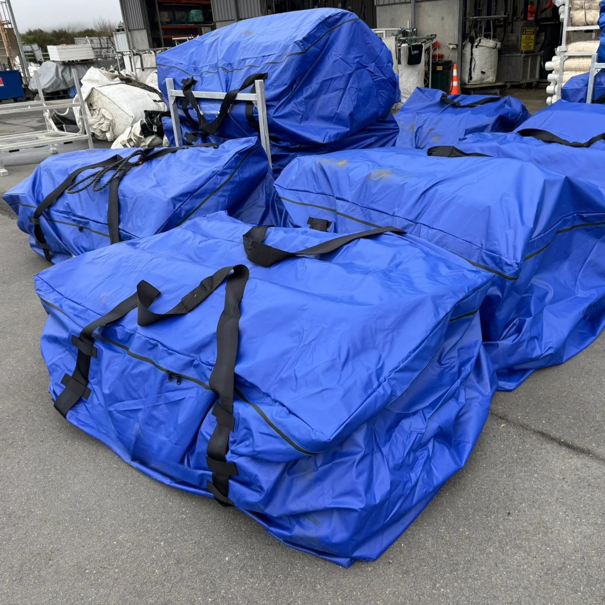 Stacks of Mussock DryBag holding knitted mussock socking