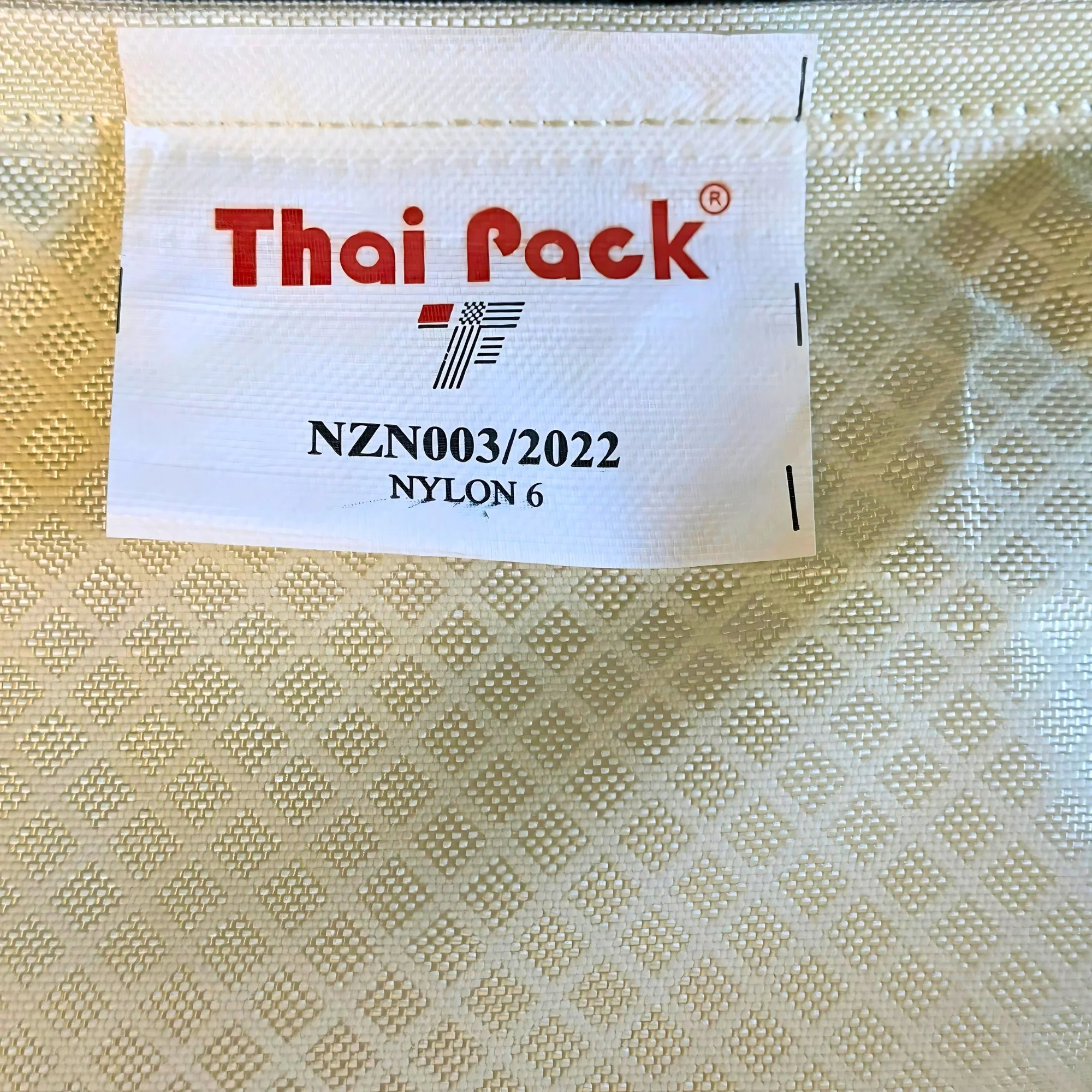 Nylon Woolpack The label reads "Thai Pack," with additional identification numbers, material specifications, and a stylized logo.