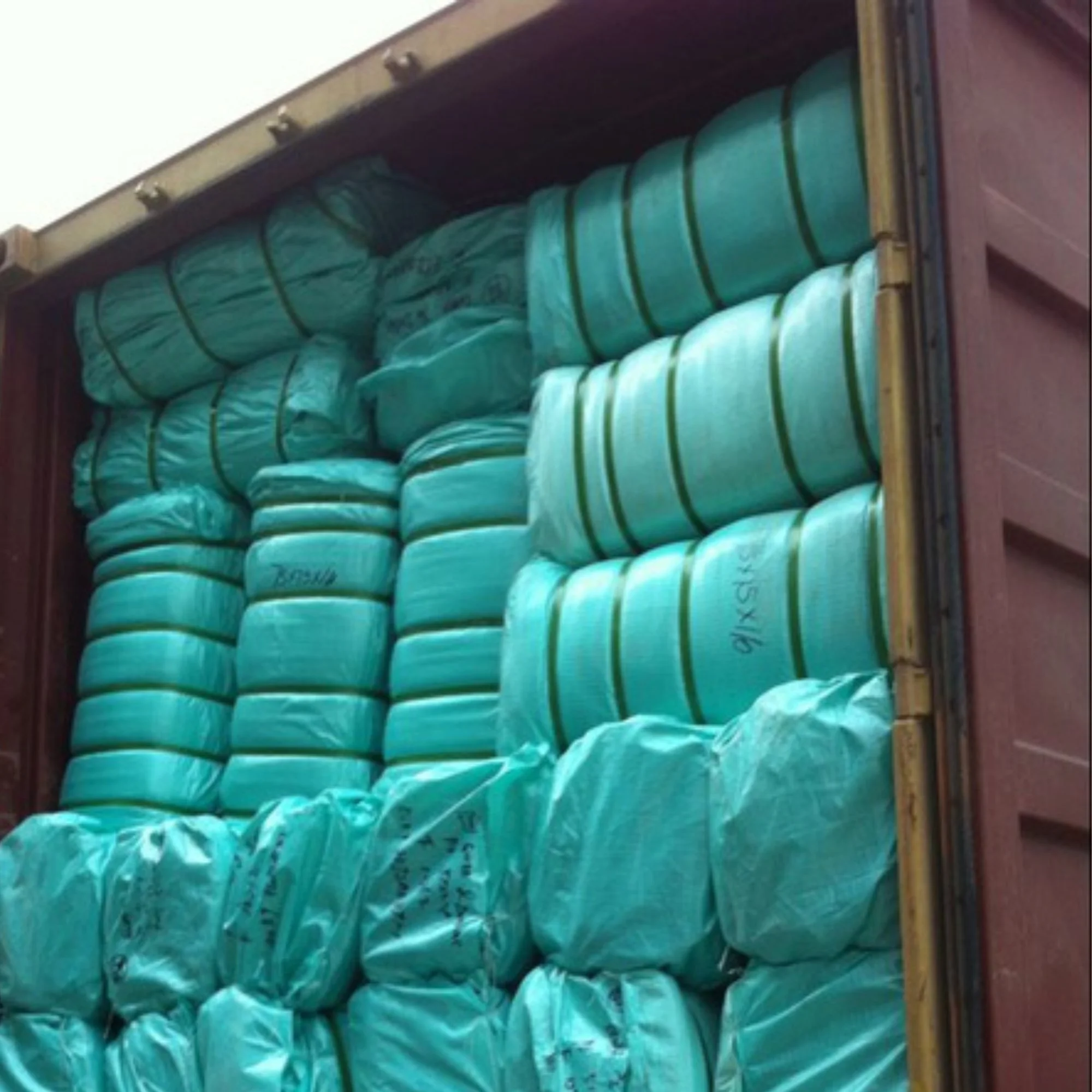 Packed cargo containers Baled HDPE woolpacks