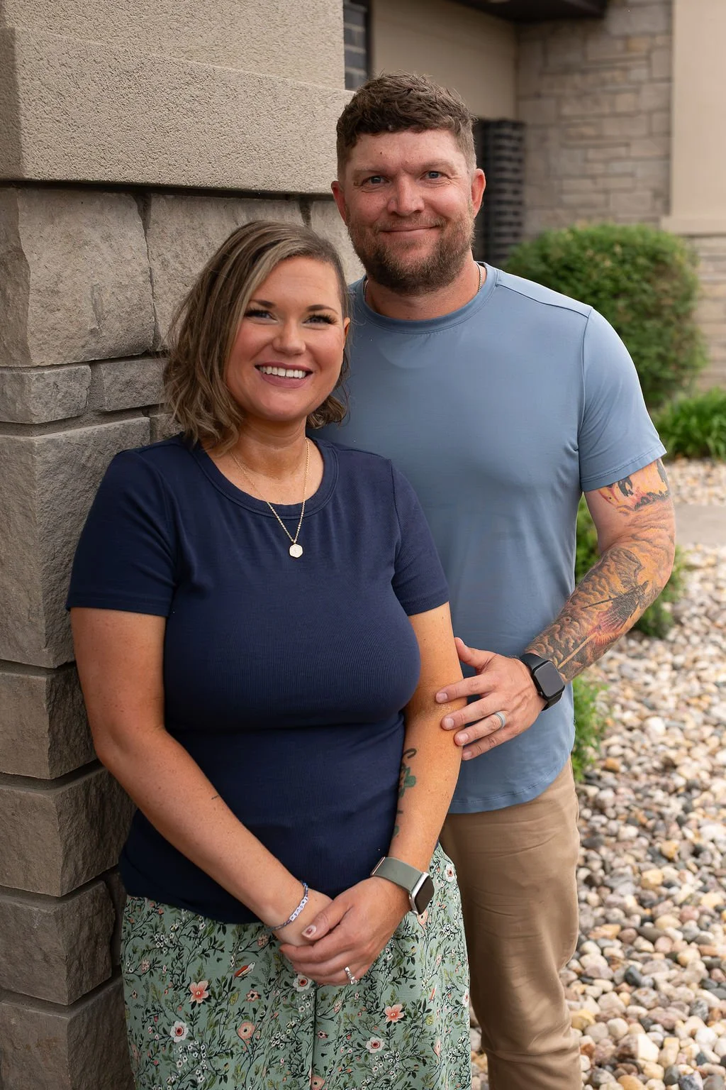 Krysta Winter, LPC-MH, QMHP, and Kyle Winter, men’s mental health coach, smiling together outside Christian Family Care, a Christian counseling and therapy practice in Sioux Falls, SD.