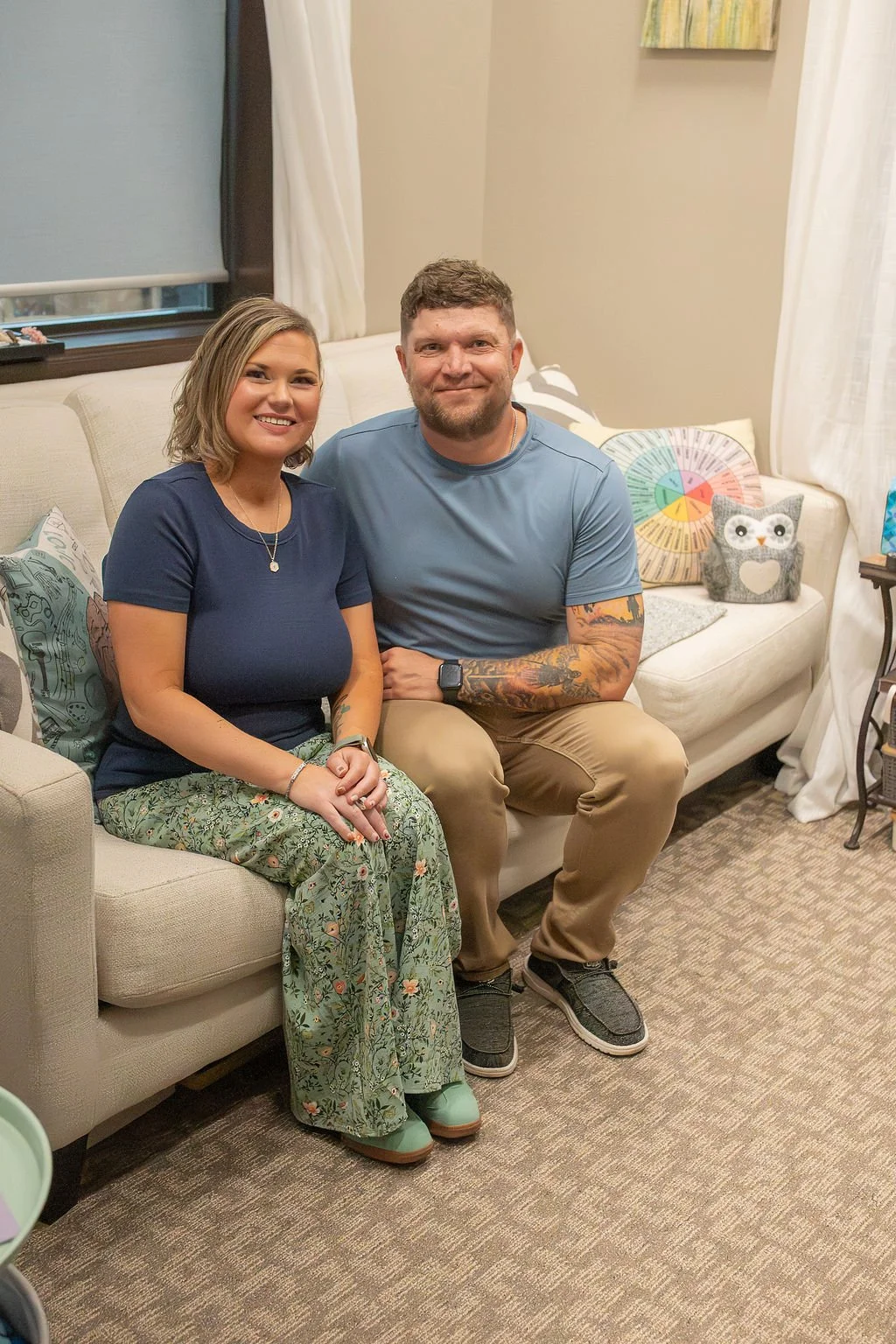 Krysta Winter, LPC-MH, QMHP, and Kyle Winter, men’s mental health coach, seated together in a welcoming therapy room at Christian Family Care in Sioux Falls, SD.