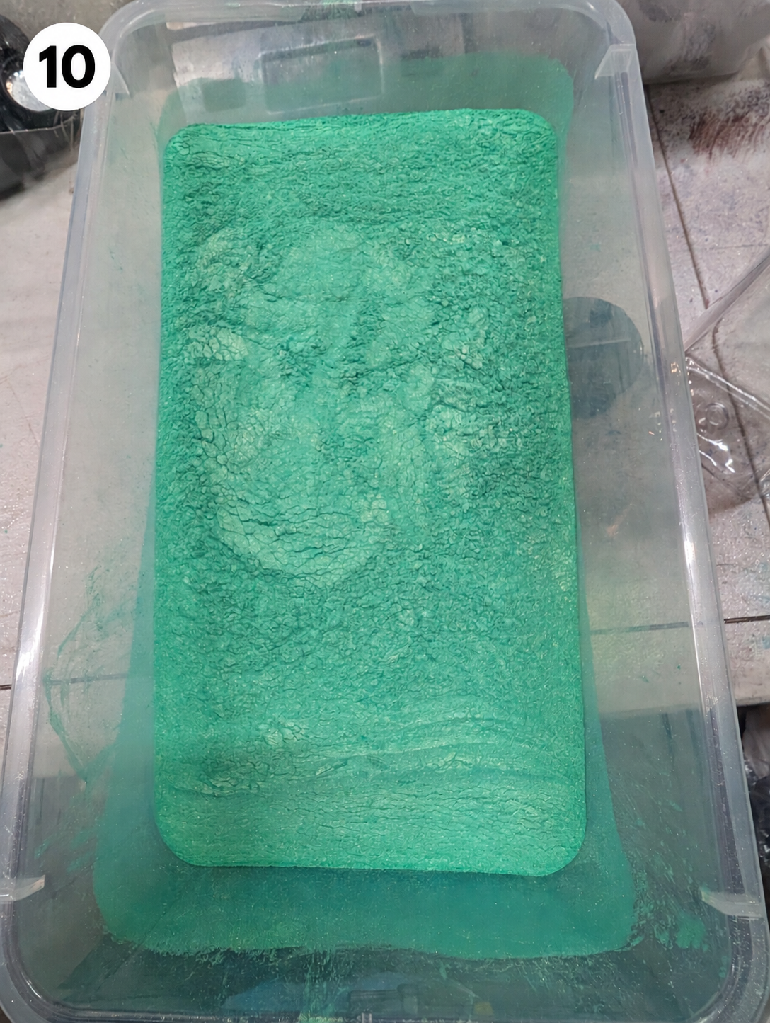 Powder container with number 10 badge.png