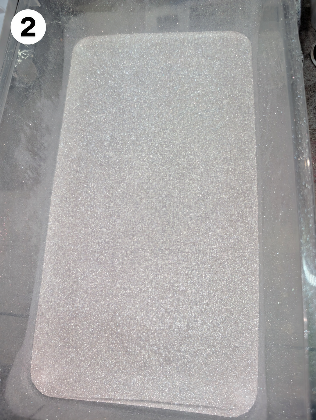 Powder container with number 2 badge.png