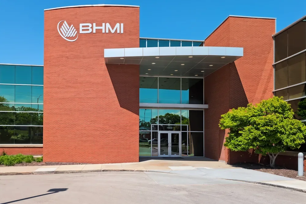 The entrance of a modern commercial building where psychiatry is practice-medication management.