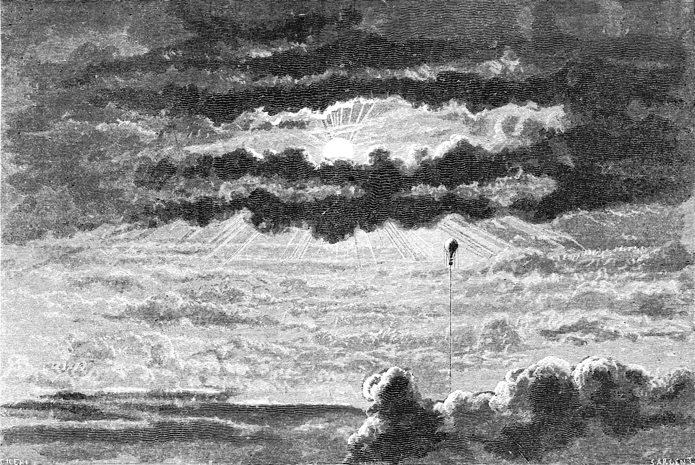 Black and white image depicting a sunset or sunrise with the sun near the horizon, clouds overhead, and rays of sunlight emanating through the clouds.
