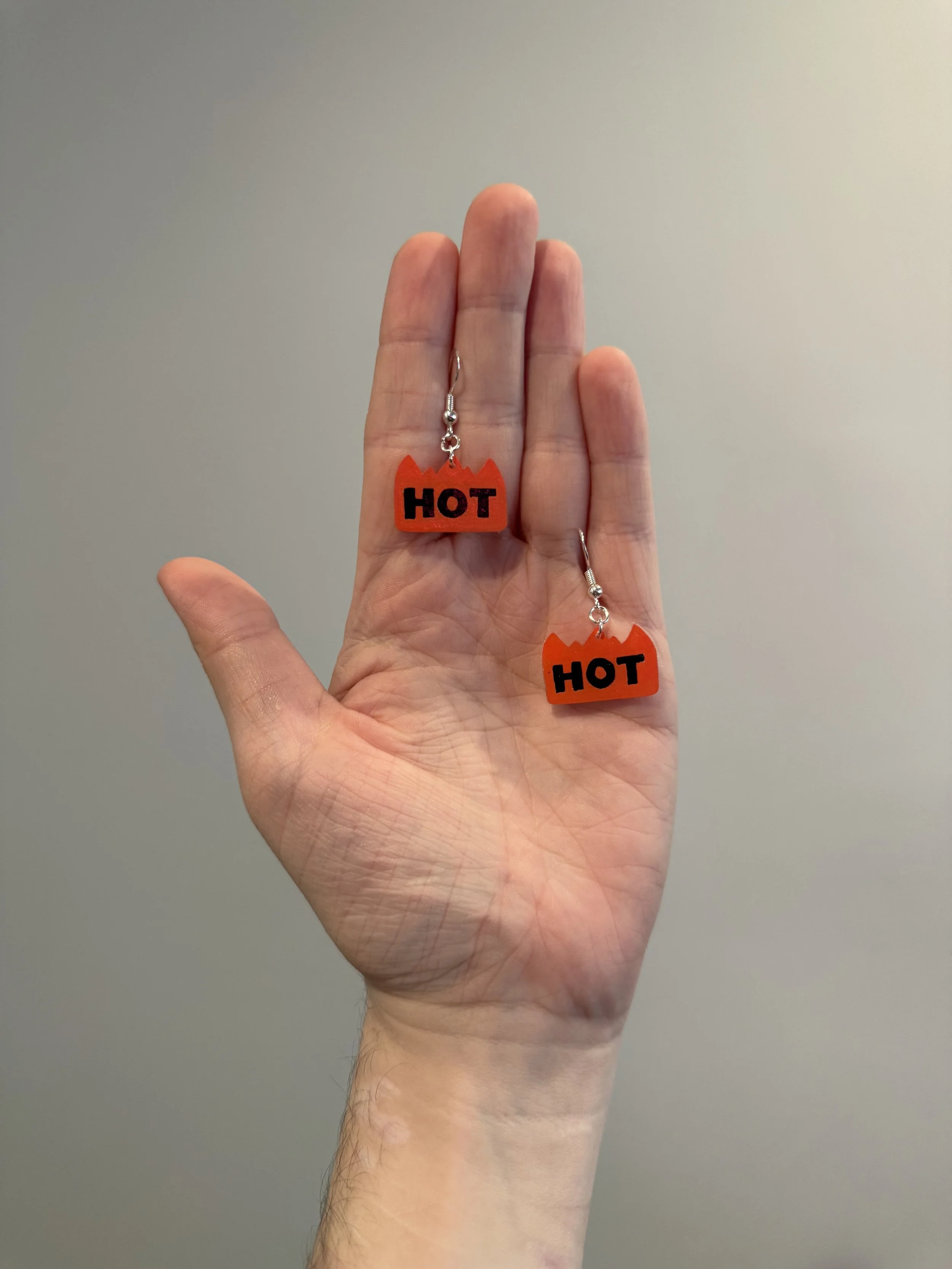 orange "hot" sticker earrings - $25