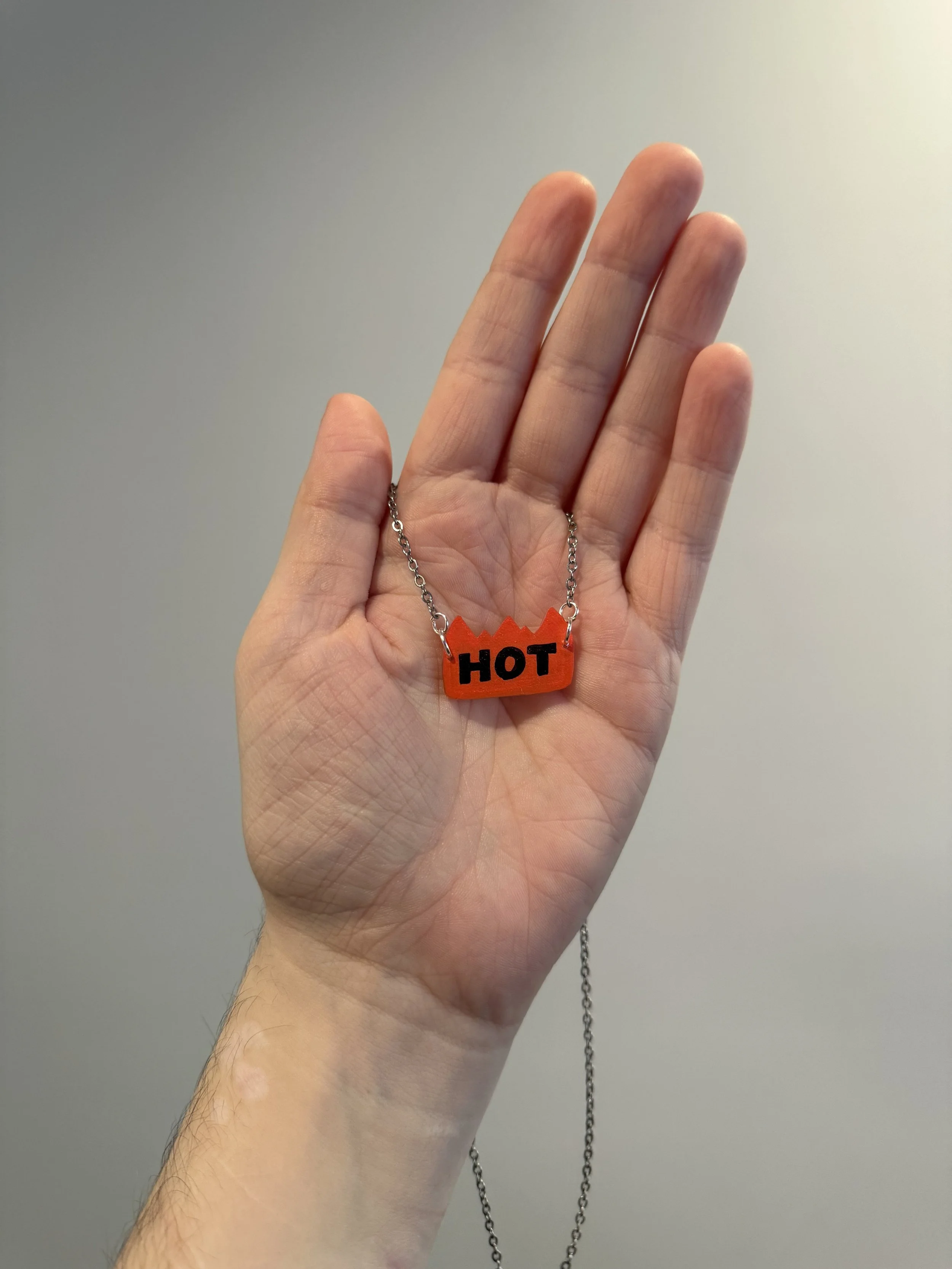 orange "hot" sticker necklace - $25