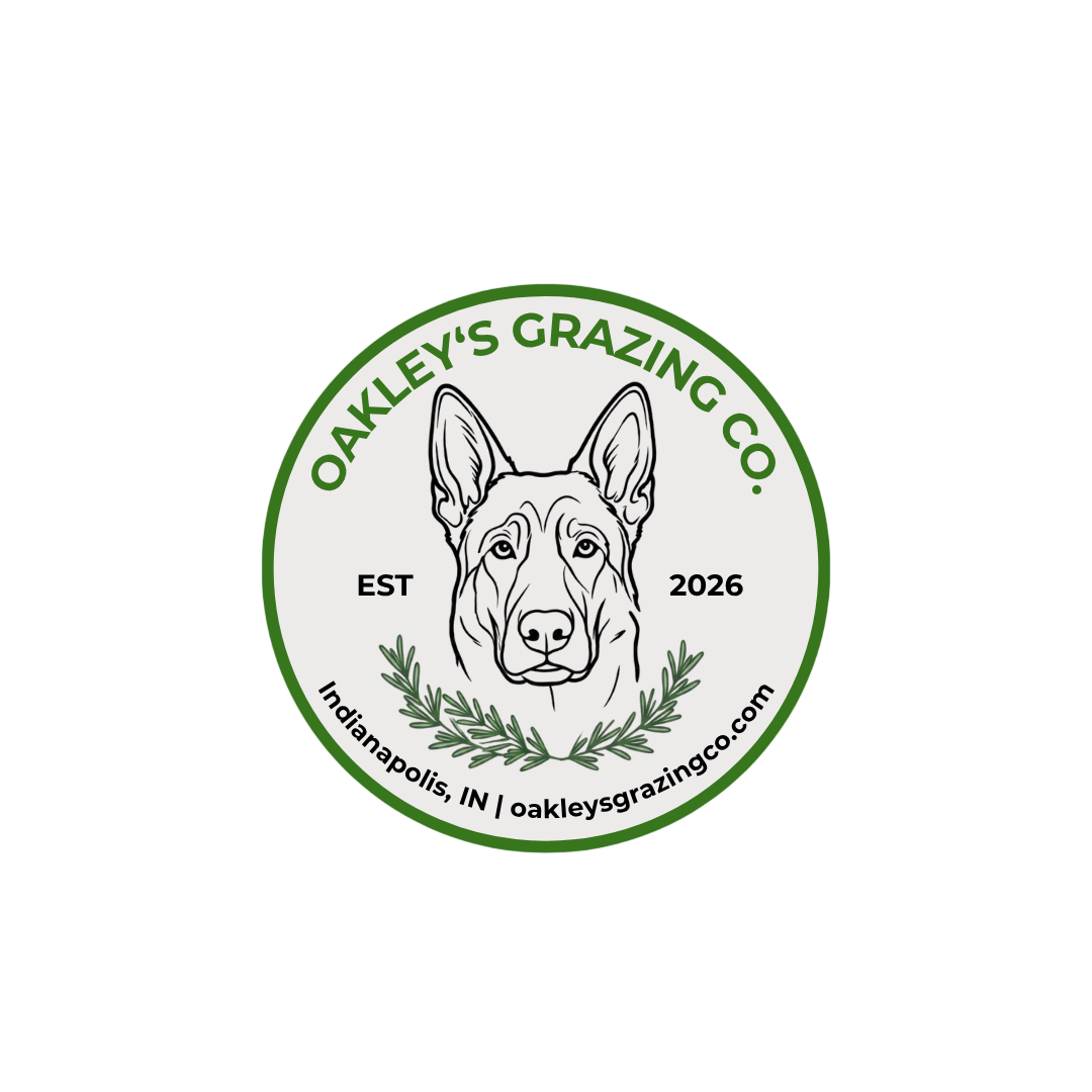 Logo for Oakley's Grazing Co., featuring a line drawing of a dog's face, green text, and a wreath, with location and website details.