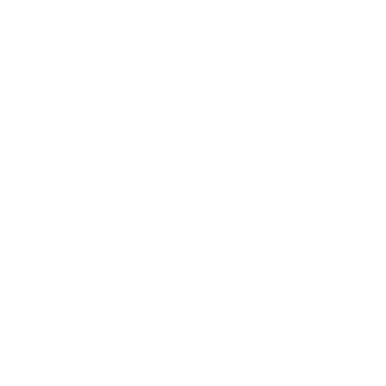 Logo of Shoal Bay Country Club with a nautical theme, featuring a sailboat illustration above the text.