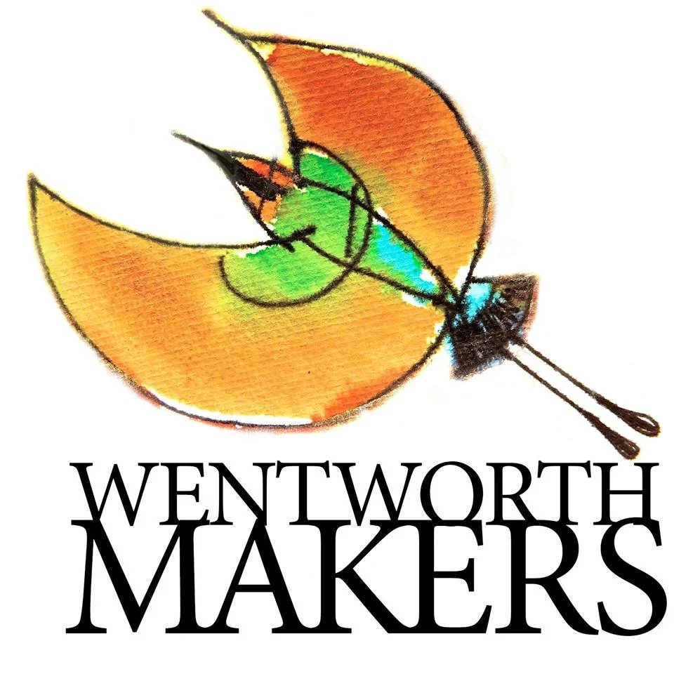 A stylized, colorful apple with a bite taken out of it, placed above the text "Wentworth Makers" in bold black letters.