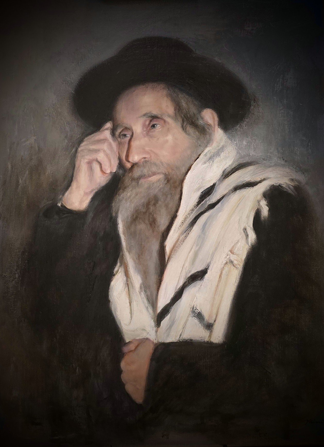 Portrait of a man with a beard and mustache, wearing a wide-brimmed black hat and a black jacket with a white scarf, resting his face on his hand.