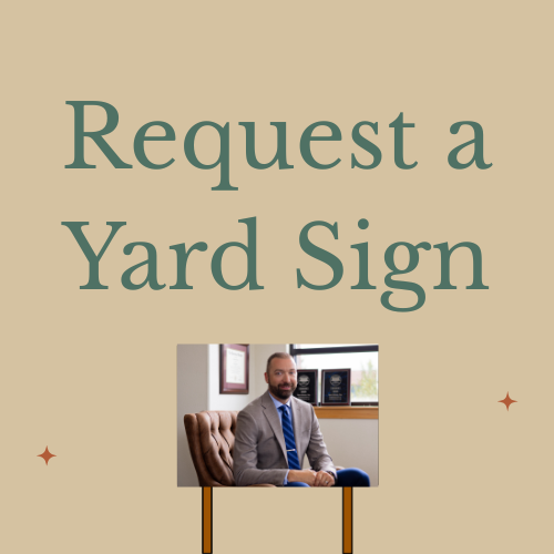 A yard sign with the text 'Request a Yard Sign' and a photo of a man in a suit sitting in an office.