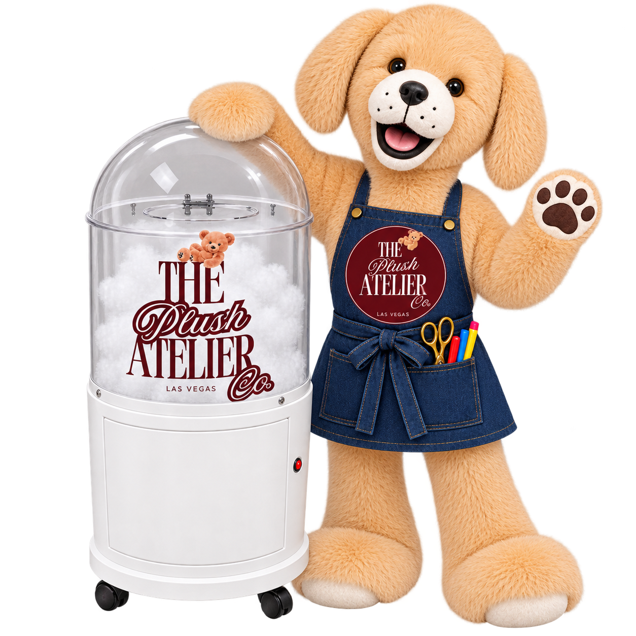 A plush teddy bear dressed as a crafts artist standing next to a cotton candy machine. The teddy bear is wearing a denim apron with scissors, markers, and a small teddy bear pin. The cotton candy machine has a logo that reads 'The Plush Atelier Co, Las Vegas' and features a small teddy bear graphic.