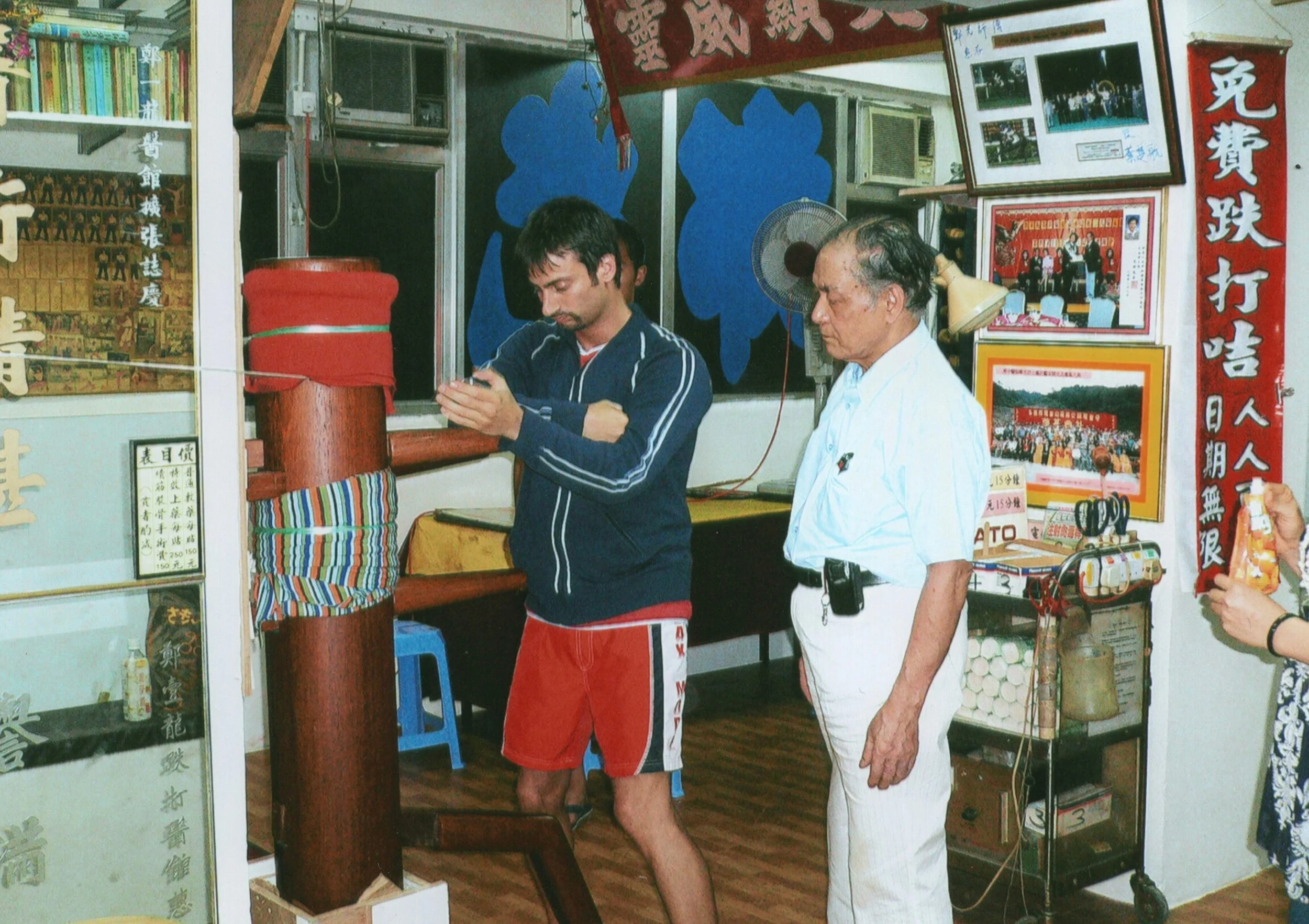 Studying the Fung Siu Ching Weng Chun wooden dummy form with Sifu Cheng Kwong in 2004