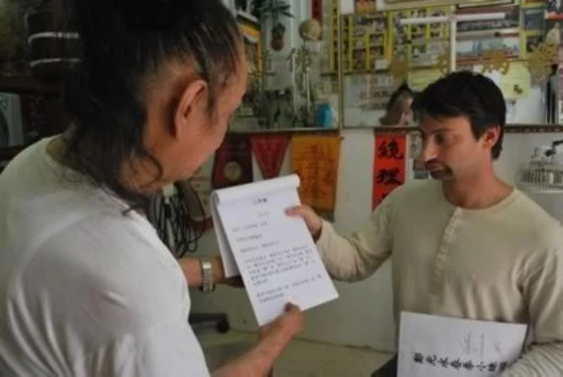 Receiving important documents concerning Weng Chun Kuen from Sifu Cheng Kwong, 2009 Hong Kong