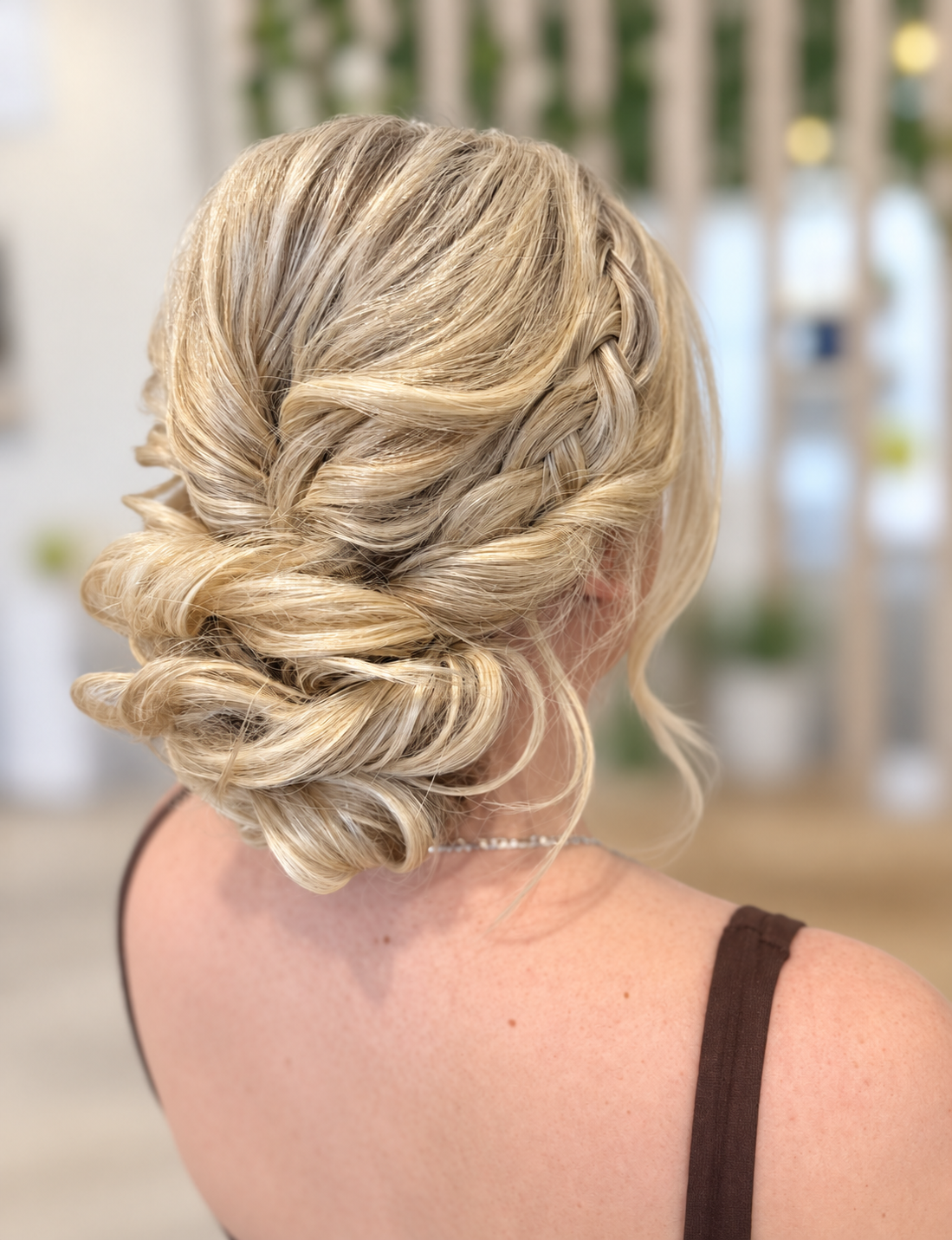 low textured up style on bright blonde bride, side pull apart braid/plait.