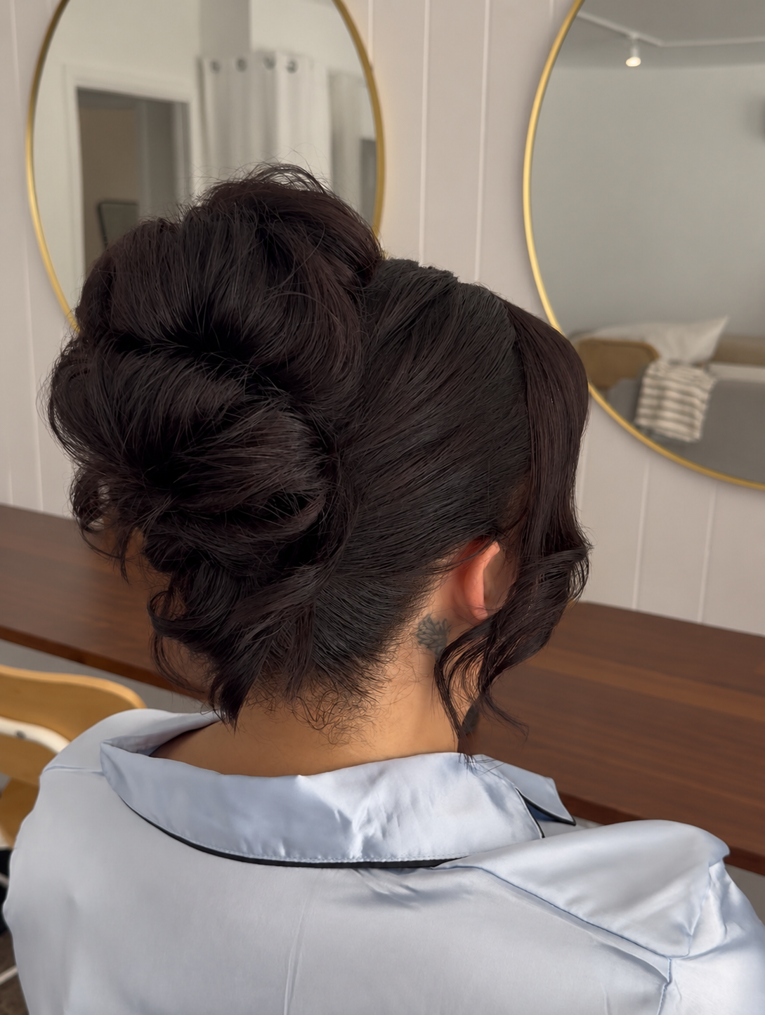 volumes upstyle on bridesmaid with dark brown hair