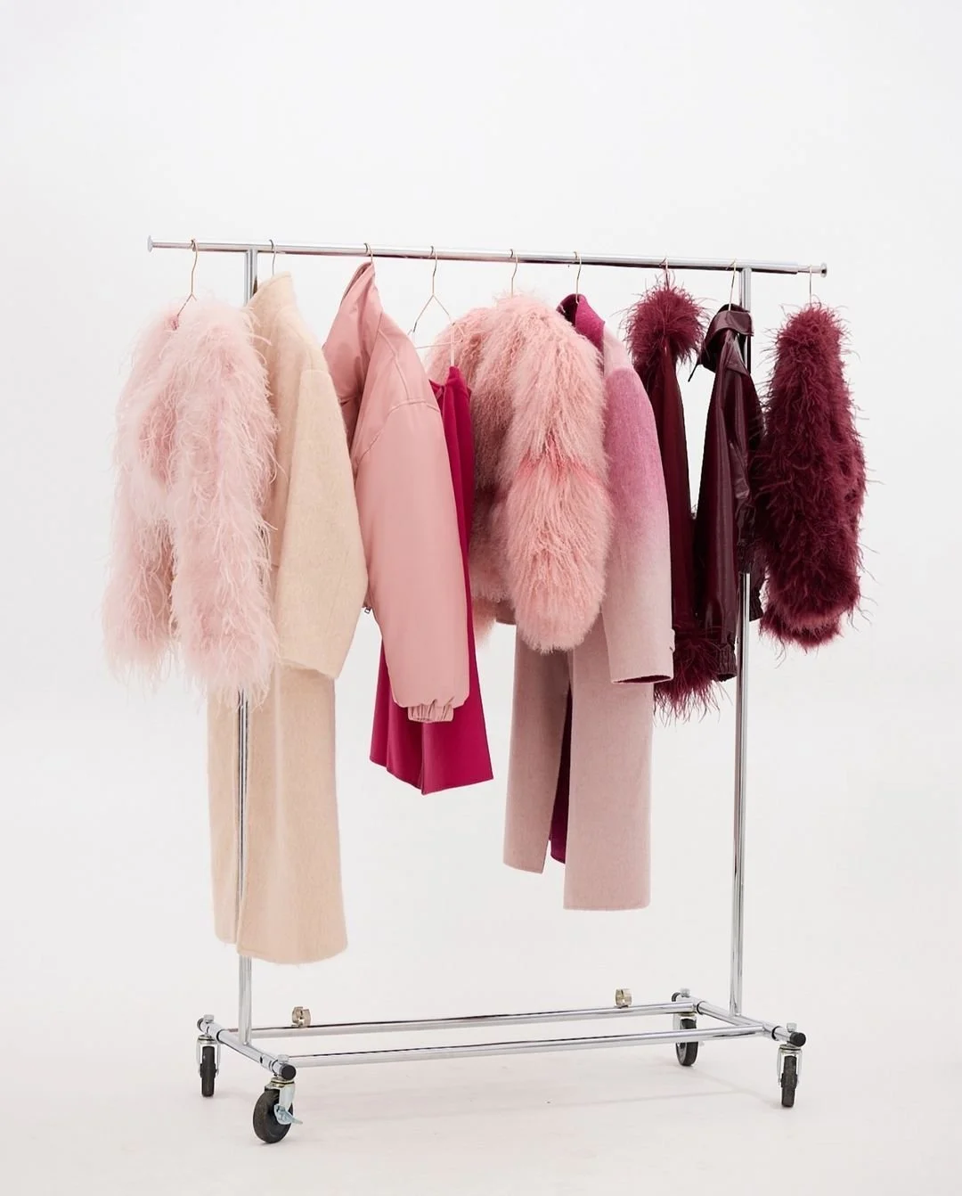 Rack of pink and red fashion pieces