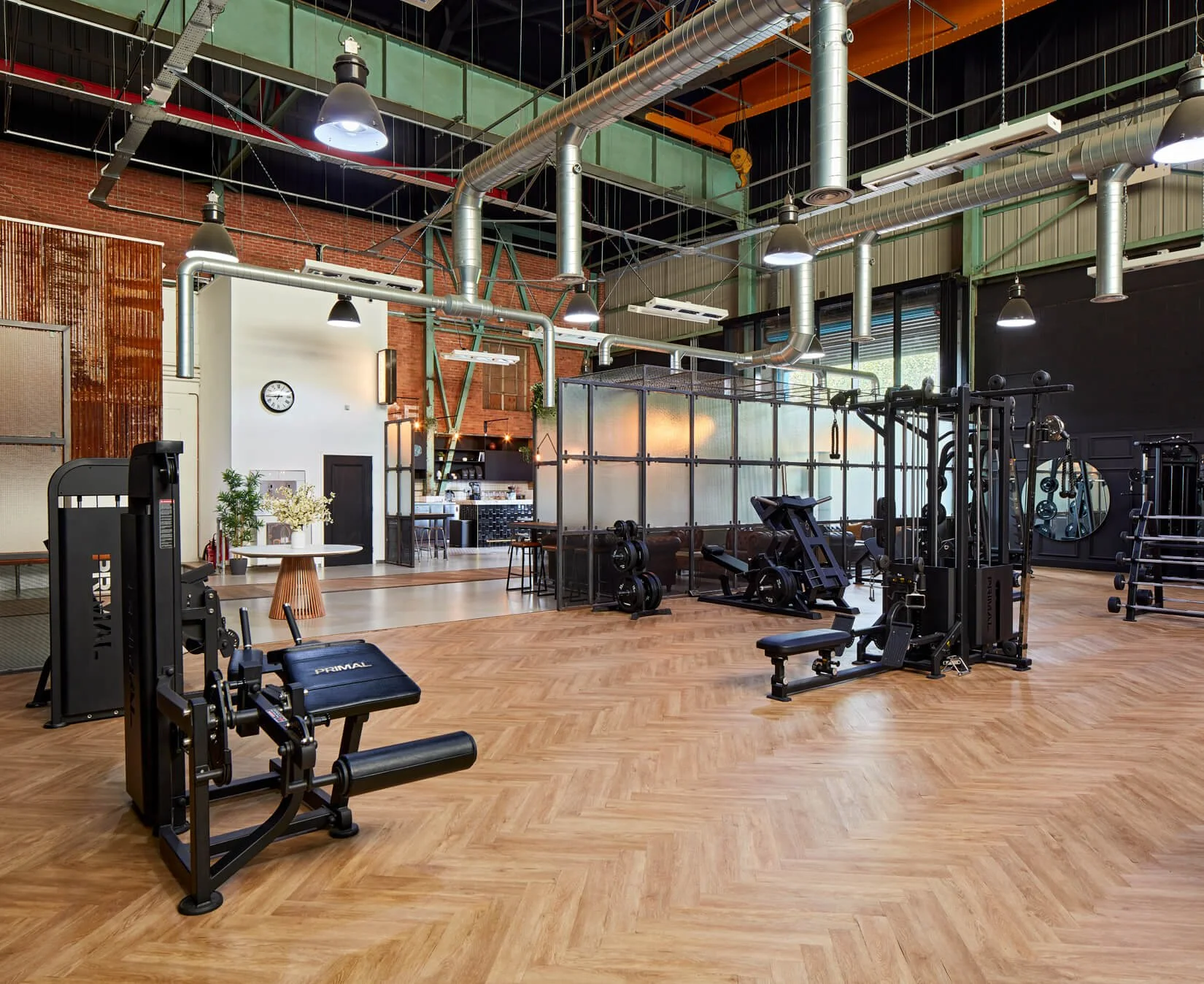Spacious, luxury gym floor with free weights and resistant machines
