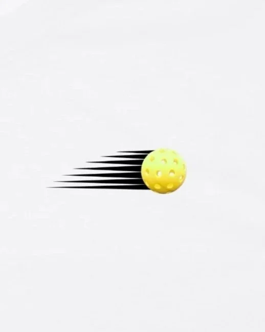 Yellow textured ball moving quickly across a white background, creating motion blur effects.