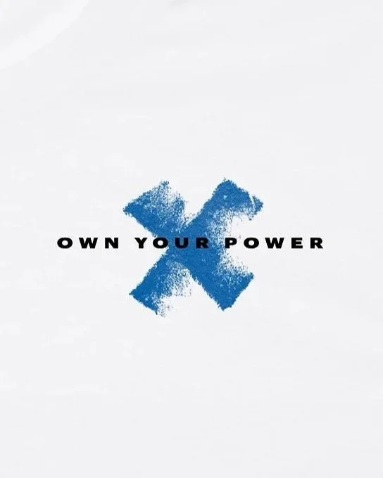 A blue 'X' mark with the words 'OWN YOUR POWER' in black, capital letters across the center on a white background.