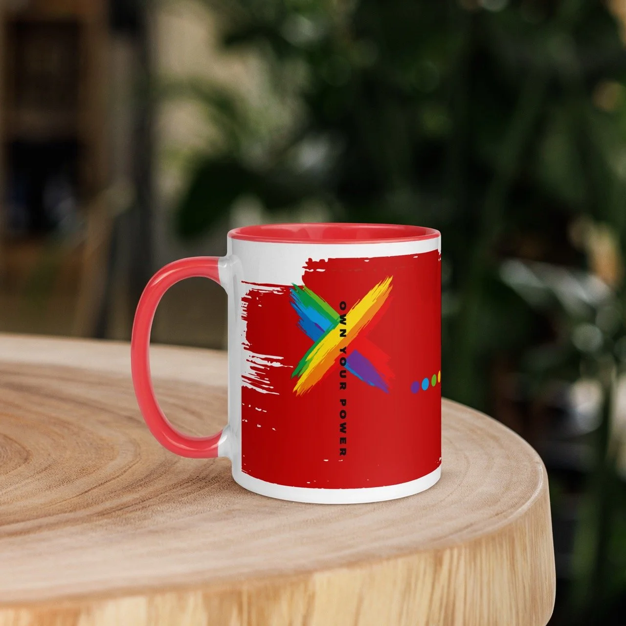 Own Your Pride Power Mug by Pickleball Merch Aus, sitting on a wood table outdoors