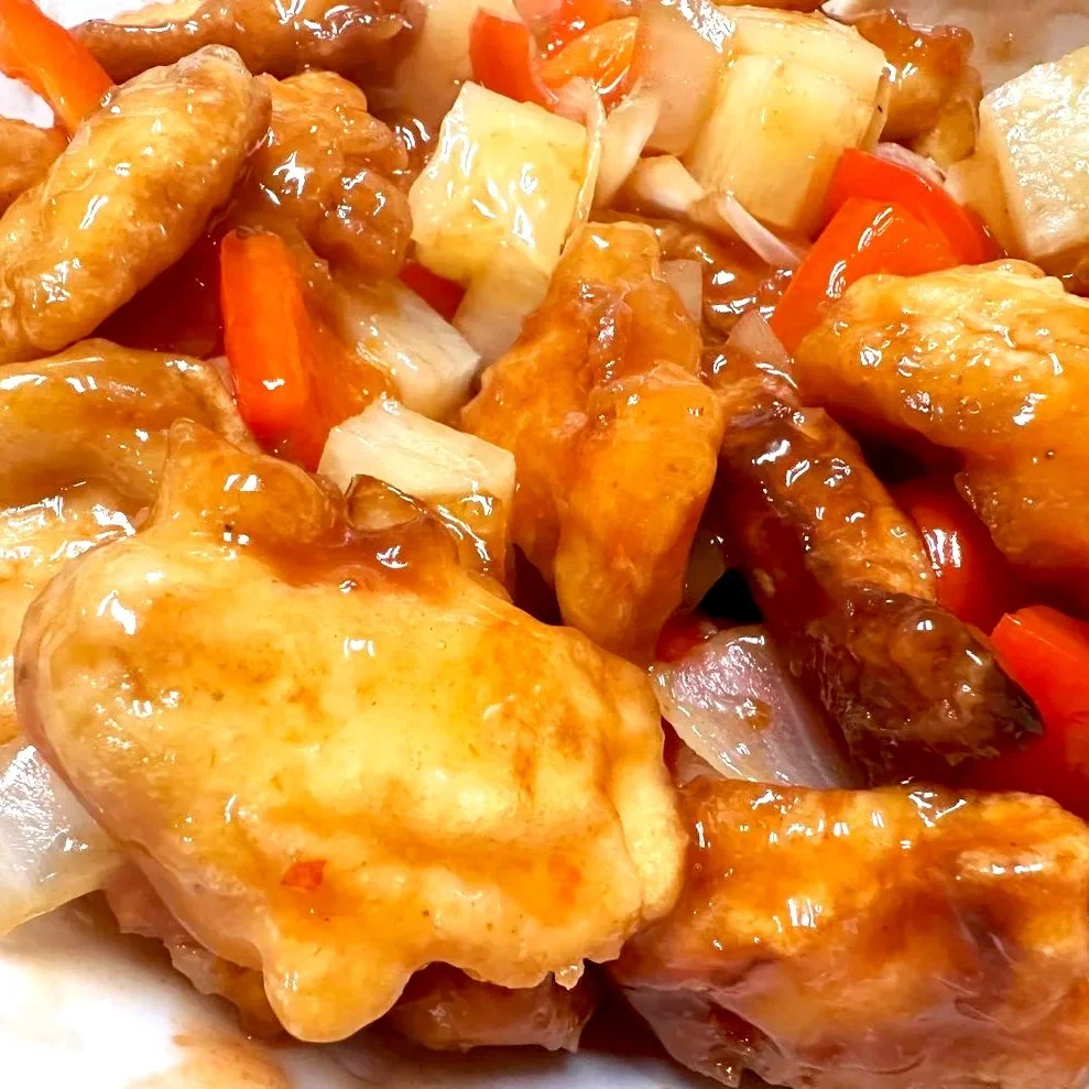 Sweet & Sour Chicken — Crispy chicken tossed with colorful peppers and pineapple.