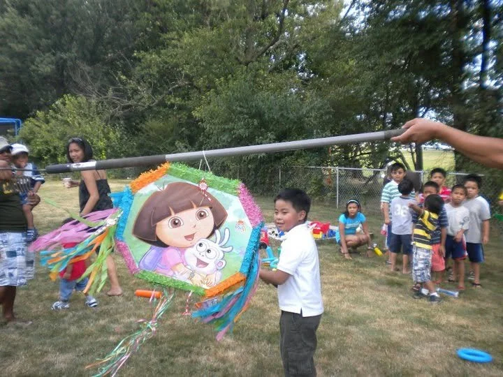 2010 july adriel hitting the pinata 2.jpg