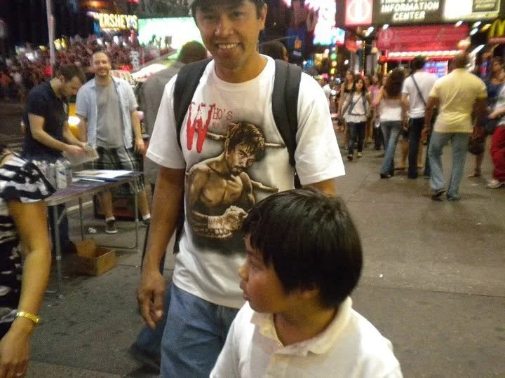 My husband and son in Times Square, July 2010.