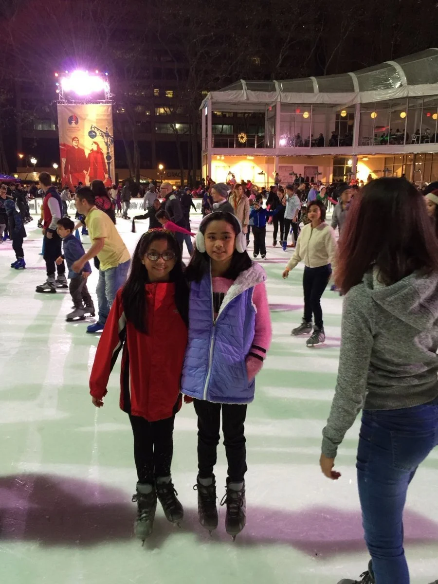 Learning and laughing together on the Bryant Park ice.