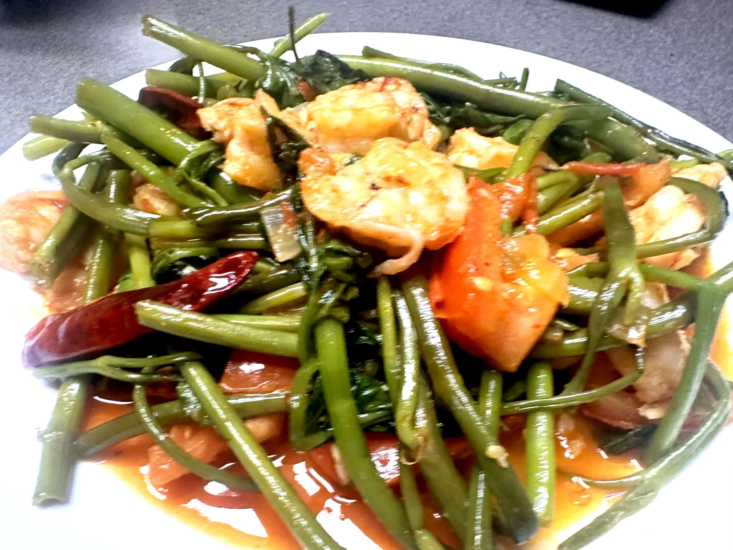 Kangkung Belachan with Shrimp & Tomatoes — a flavor I first discovered in Singapore.