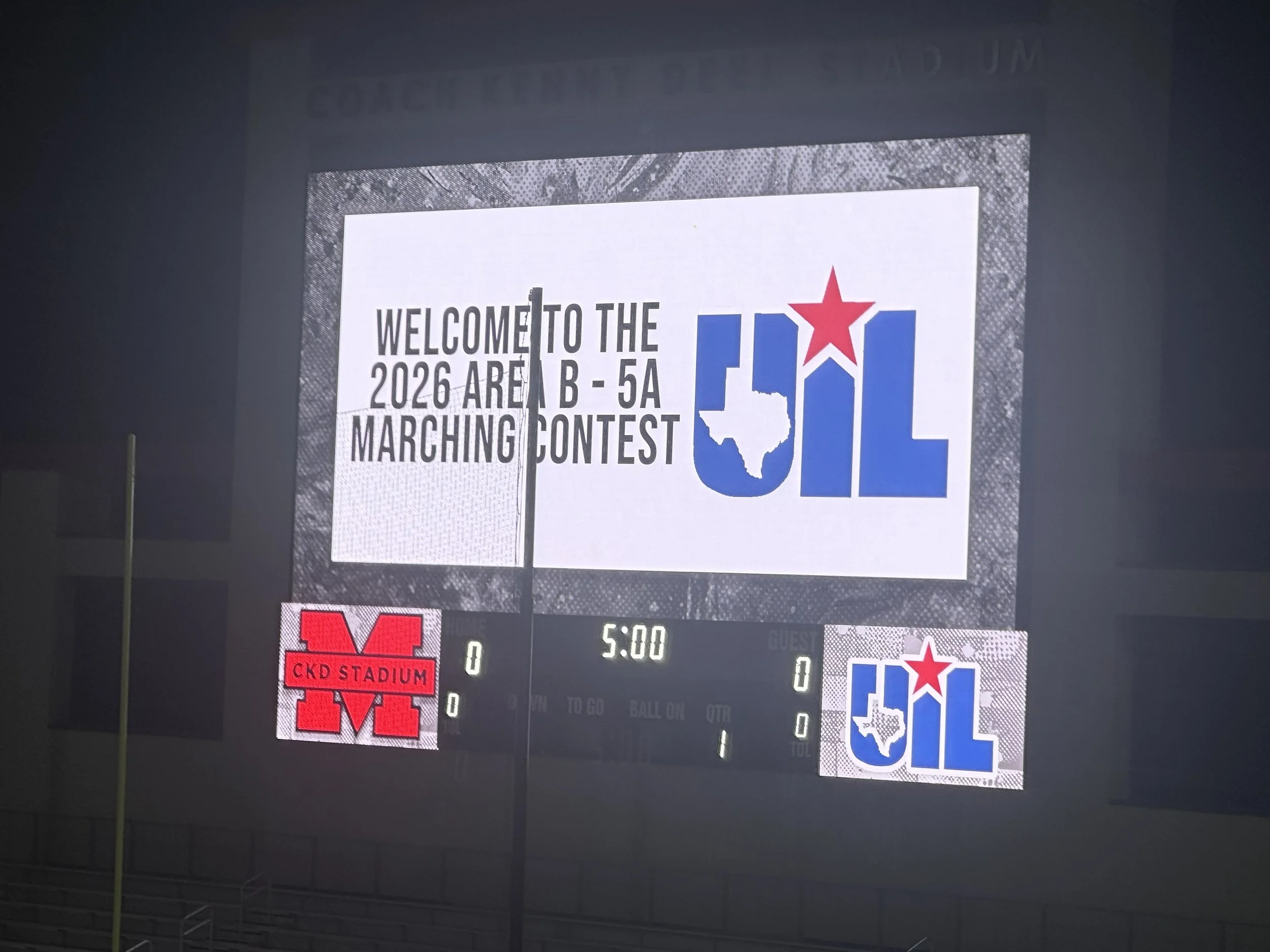 Stadium screen welcoming visitors to the 2026 UIL Area B 5A Marching Contest at Coach Kenny Deel Stadium in Melissa, Texas.
