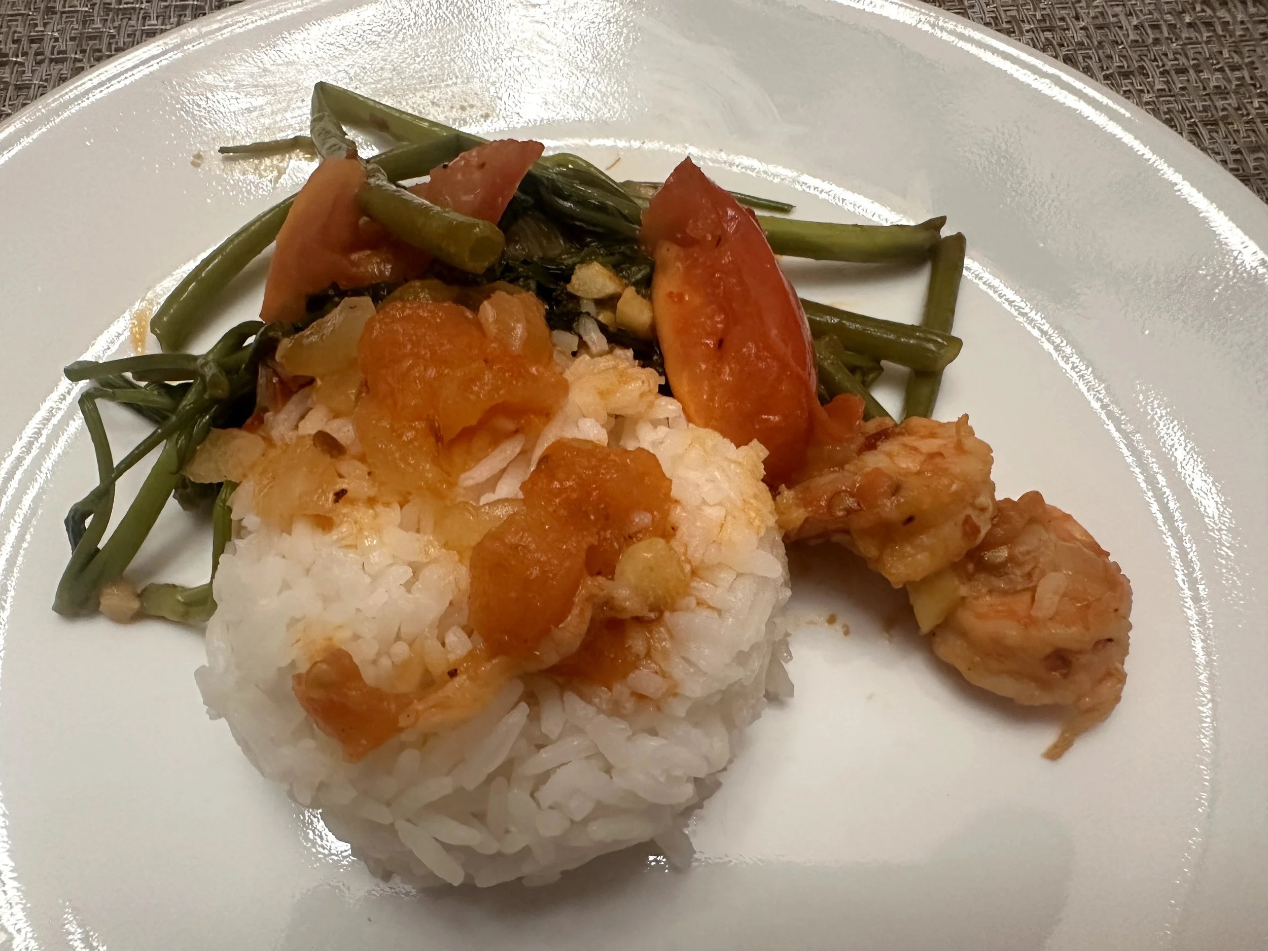 Kangkung belachan with shrimp and tomatoes served with steamed white rice