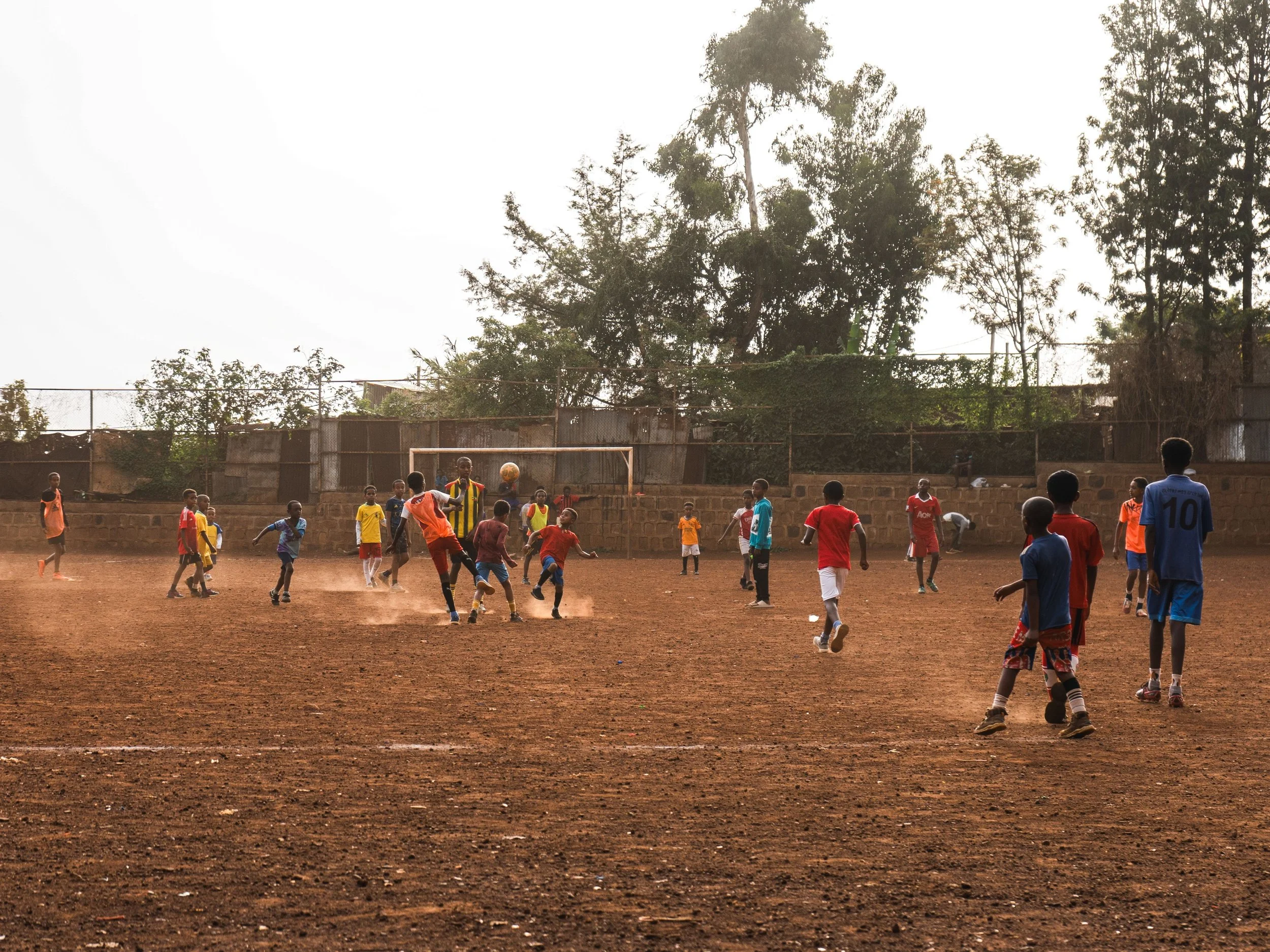 Children playing on a dirt football field - Photo by Tsion  Molla from Pexels: https://www.pexels.com/photo/youth-soccer-game-in-addis-ababa-field-36650896/