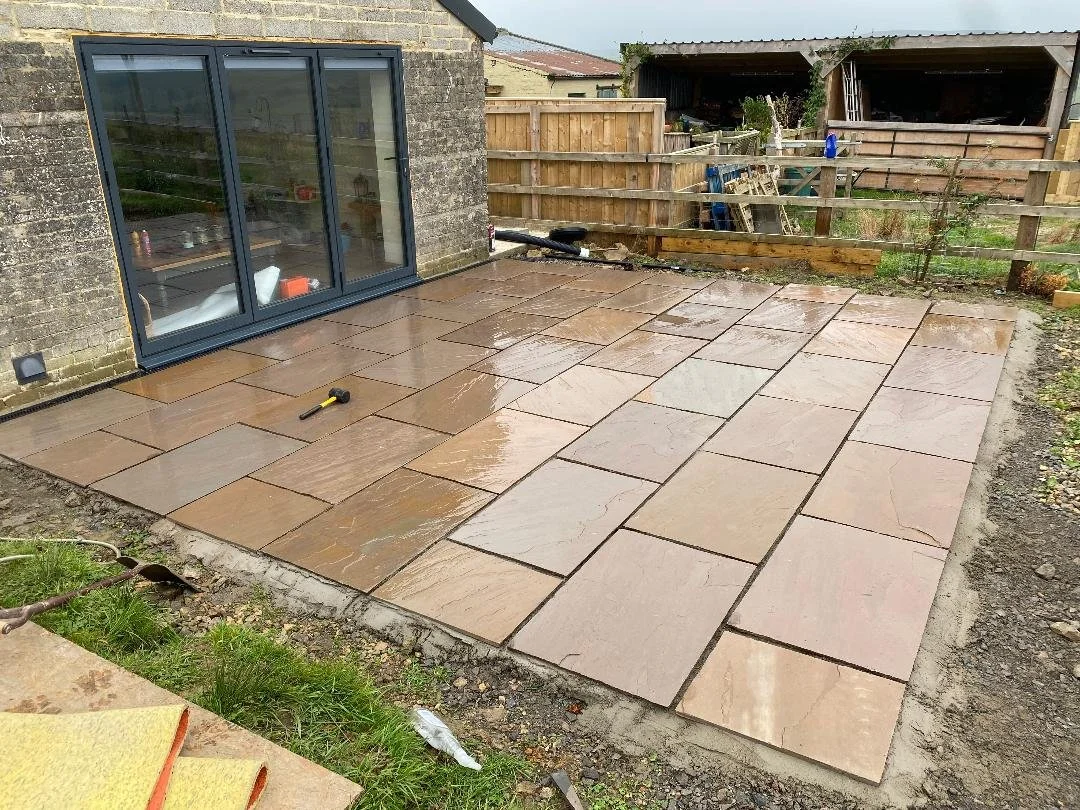Oranssi technician working on a roof project
