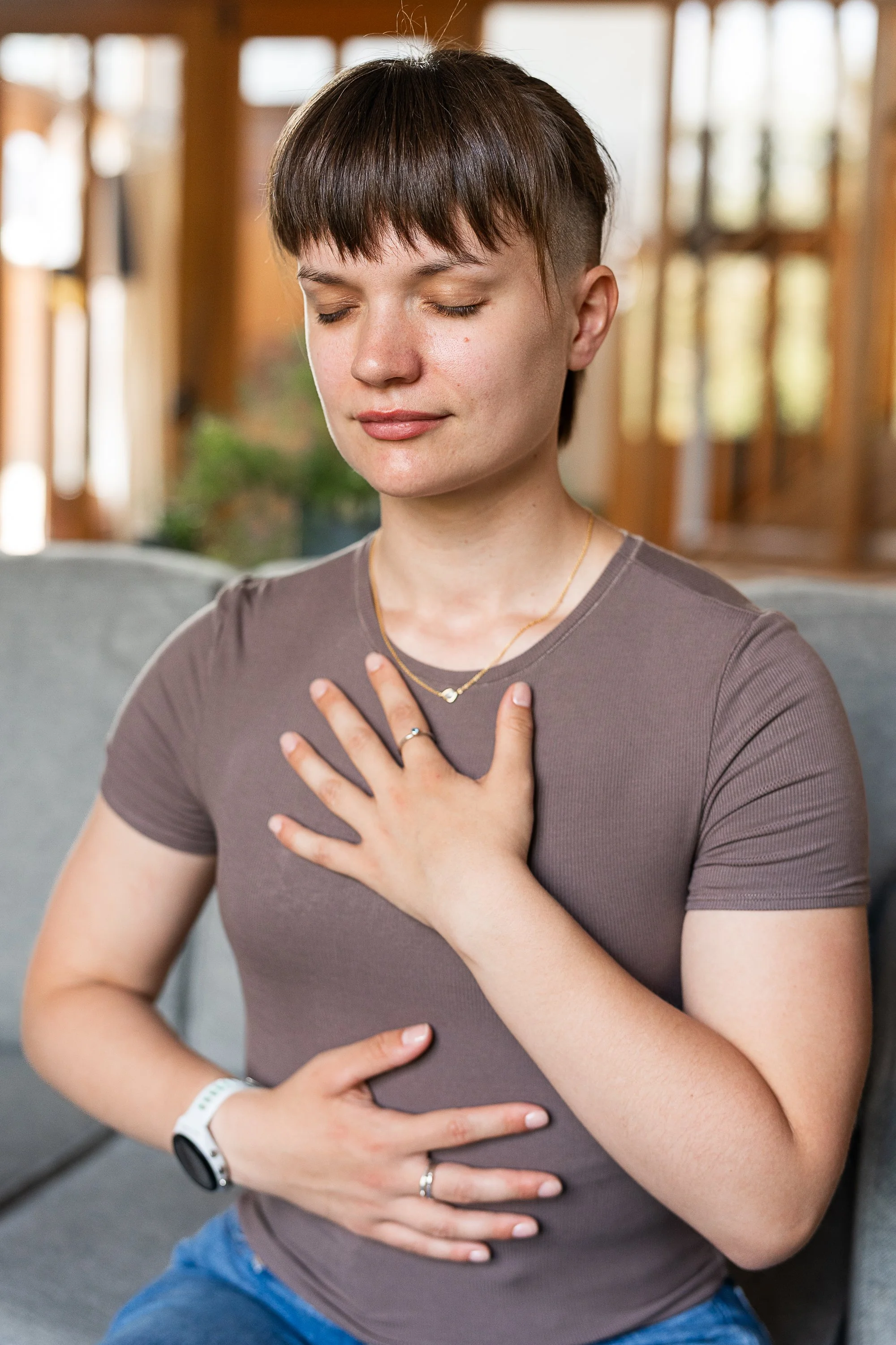 Therapist and yoga teacher meditating and practicing breathing techniques.
