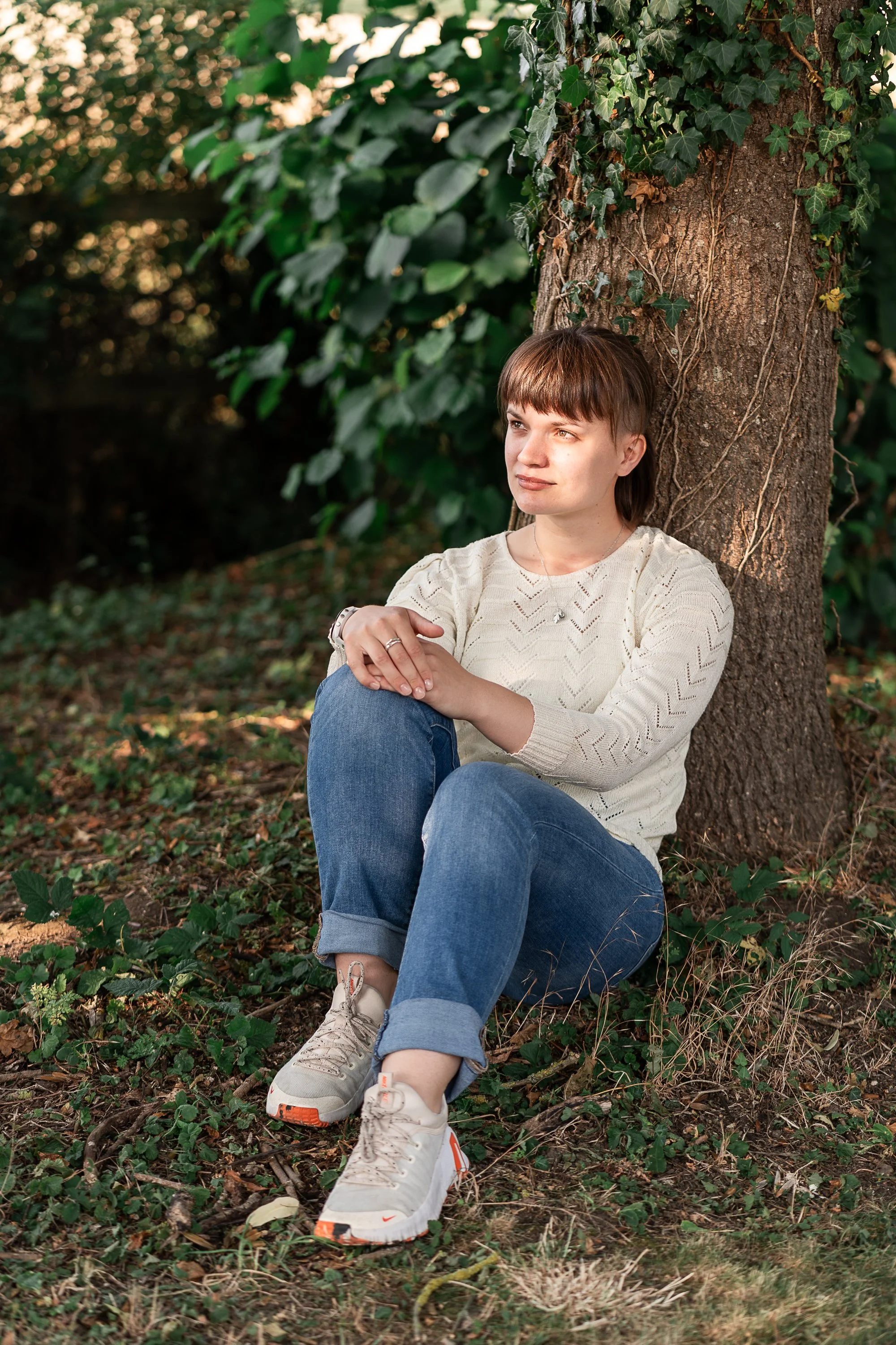 Walking therapist in Greenwich, sitting down outdoors.
