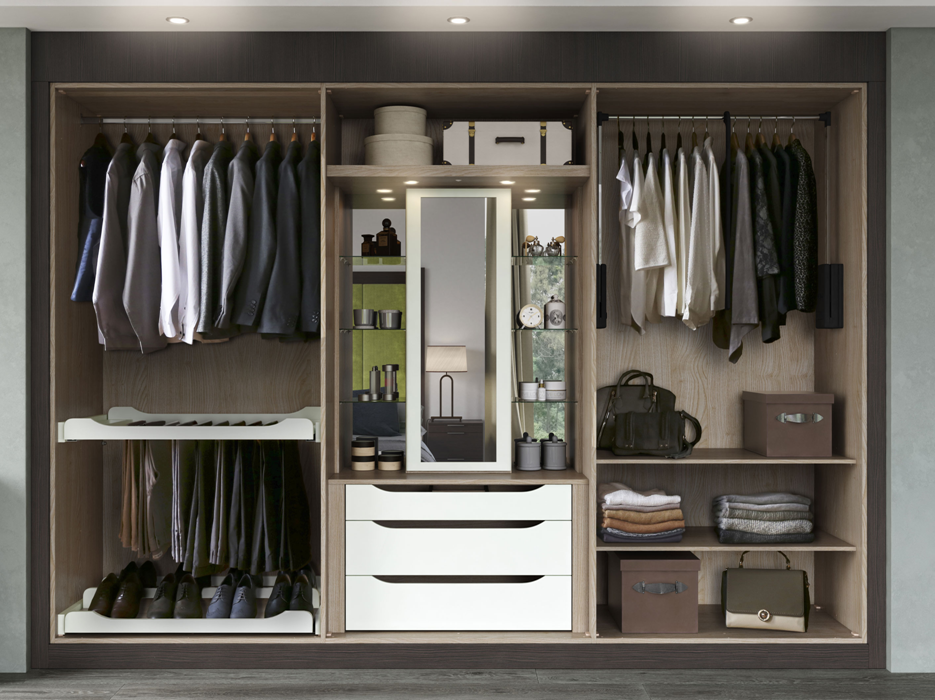 Open wardrobe with suits, shirts, trousers, shoes, and accessories, including storage boxes and a mirror.