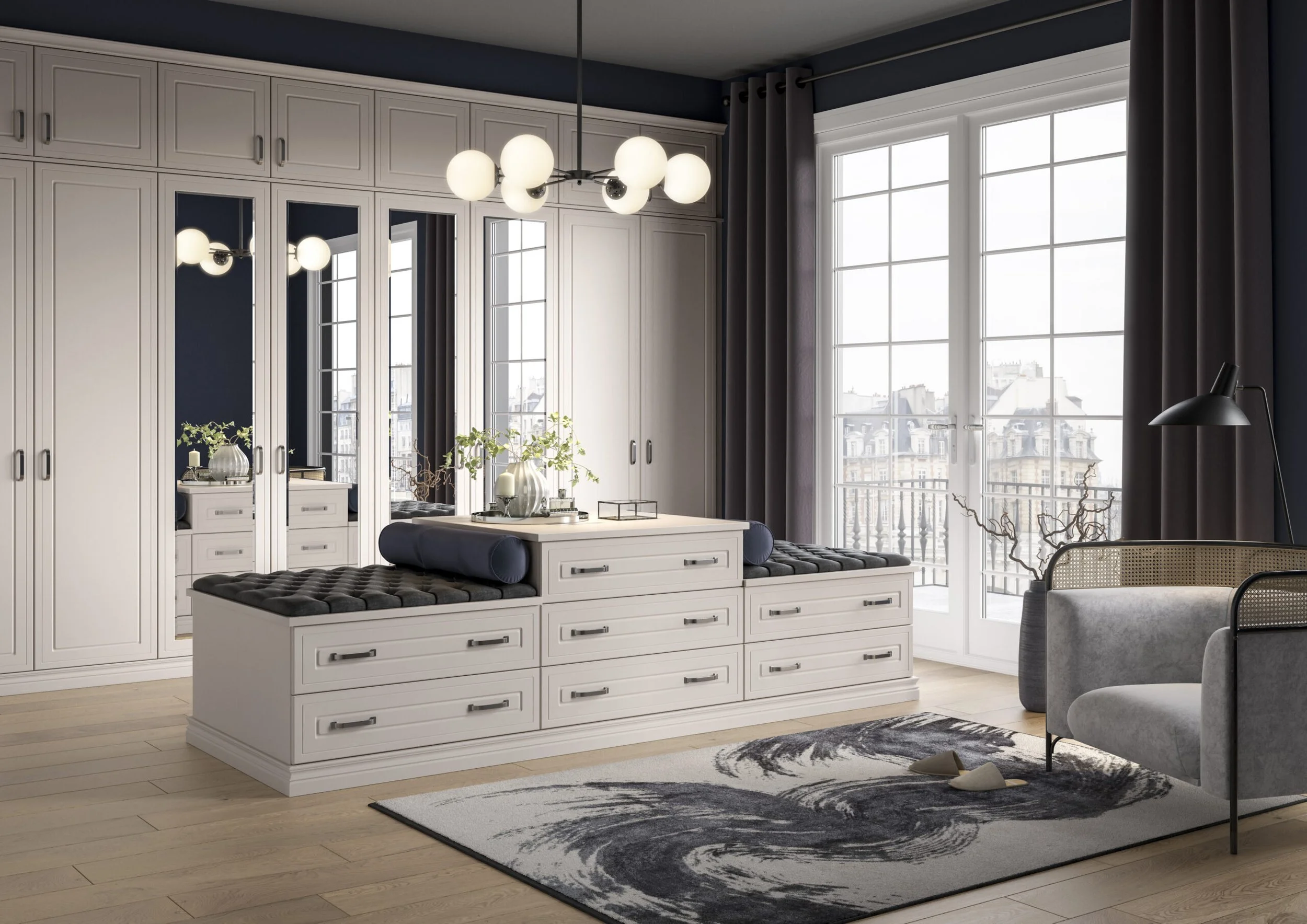 A modern living room with large windows, white cabinetry with mirrors, and a black and white rug. There is a hanging chandelier with globe lights, a gray armchair, and decorative items like plants and candles on the table.