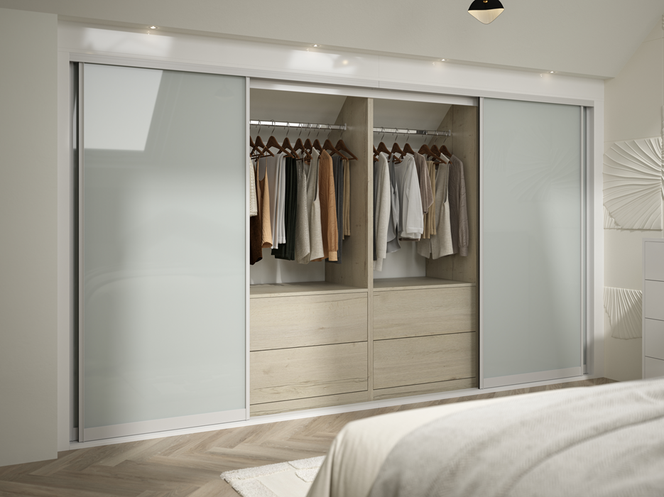 Modern closet with sliding frosted glass doors, containing hanging clothes and built-in drawers.