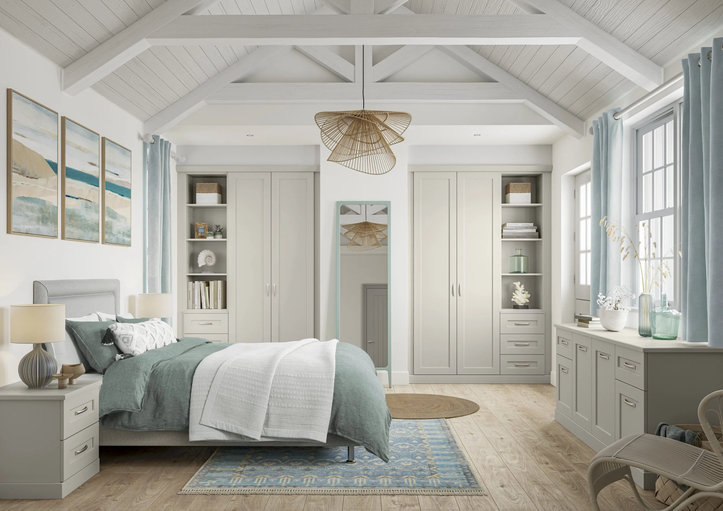 A bedroom with a sloped wooden ceiling, a bed with a green comforter, white pillows, and a window with light blue curtains. There are built-in cabinets, decorative items, a mirror, and a blue patterned rug.