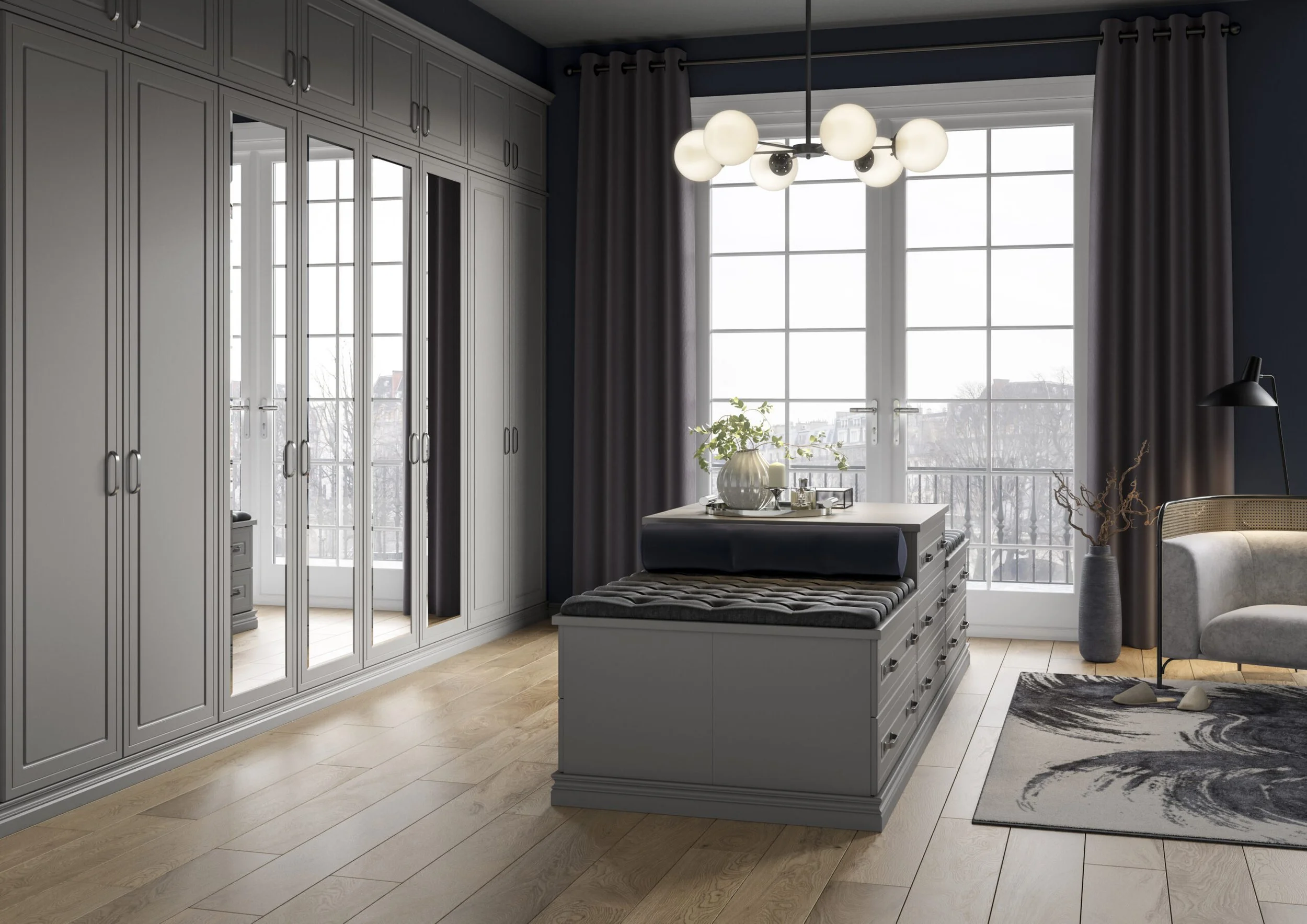 Interior view of a modern living room with large white window, grey cabinets, a black and white rug, a coffee table with plants, a cushioned bench, a black floor lamp, and closed dark curtains.