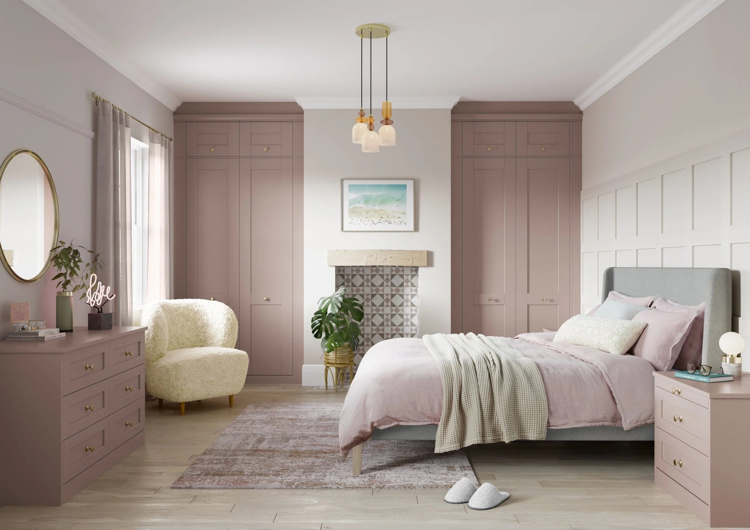 A cozy bedroom with pink and white accents, featuring a bed, dresser, side tables, curtains, a mirror, artwork, and a fireplace, with slippers on the floor.