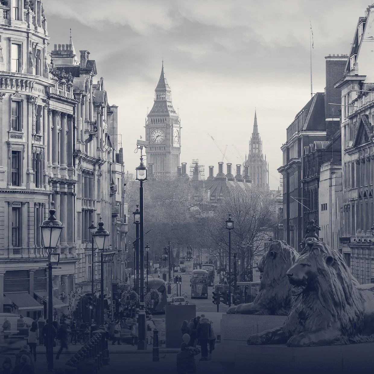 A black and white photo of a historic city street in London, featuring the iconic clock tower known as Big Ben, with classical buildings, street lamps, lion statues, and people walking.