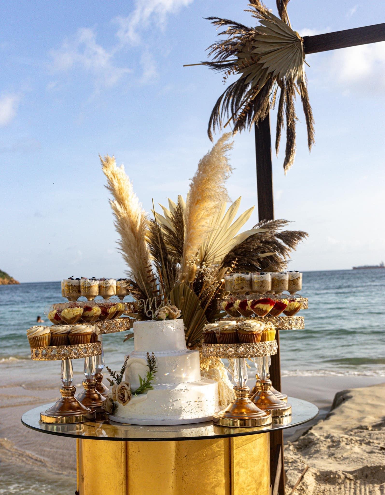 Palm tree lined beach aisle with lanterns for wedding ceremony