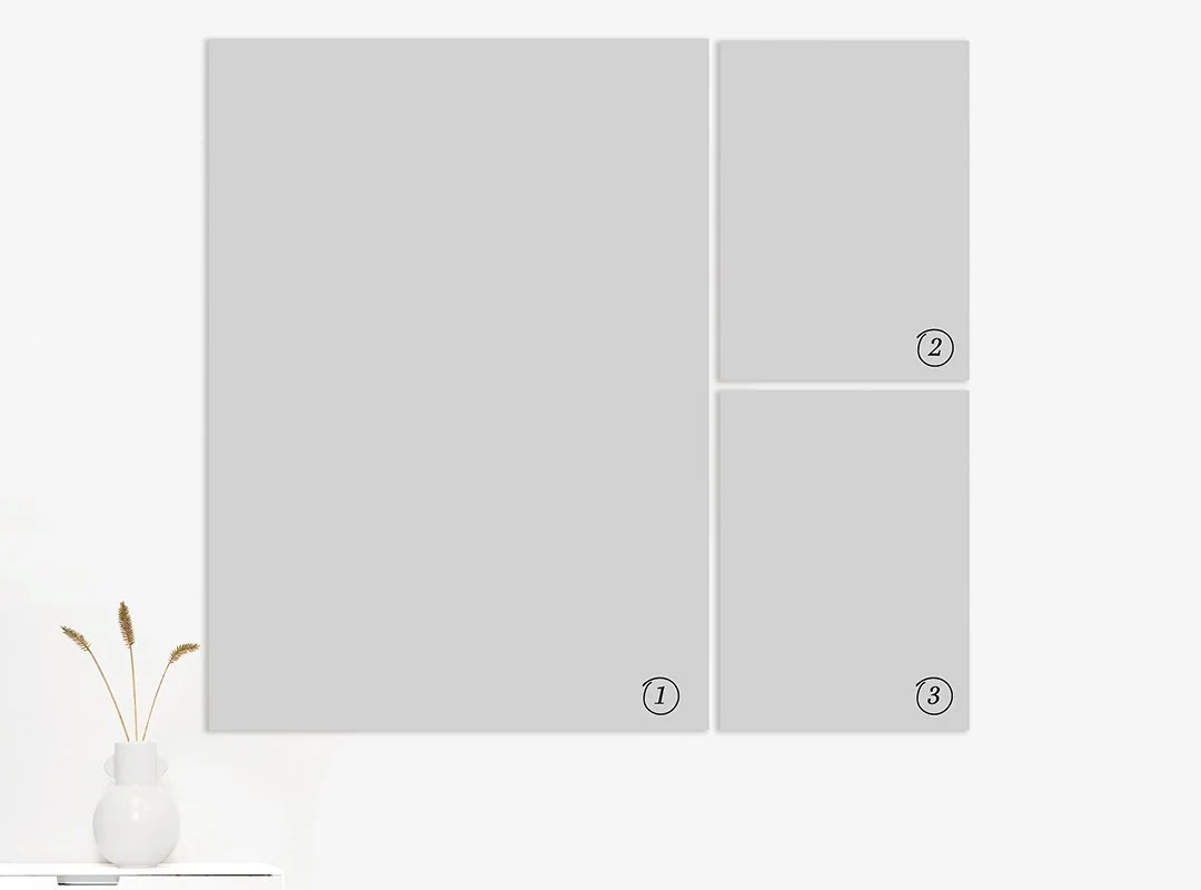 A wall with four rectangular panels arranged in a grid, with three of them numbered 1, 2, and 3, and a white vase with a small plant on a white surface beside the wall.