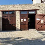 Wooden gate and door in brick wall exterior