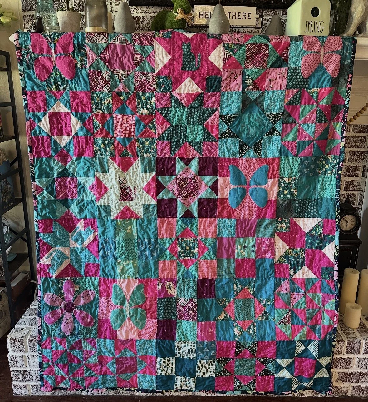 This one has my favorite colors. It is slightly too small so I dont use it but I want to make another one in these colors that is bigger!  I machine pieced and hand quilted this one. I was on a stars kick and added tons of cats. How many can you find
