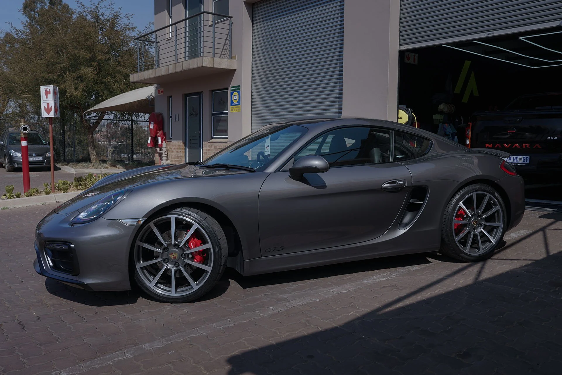 Porsche Cayman parked outside the Innovation Auto workshop in Kyalami