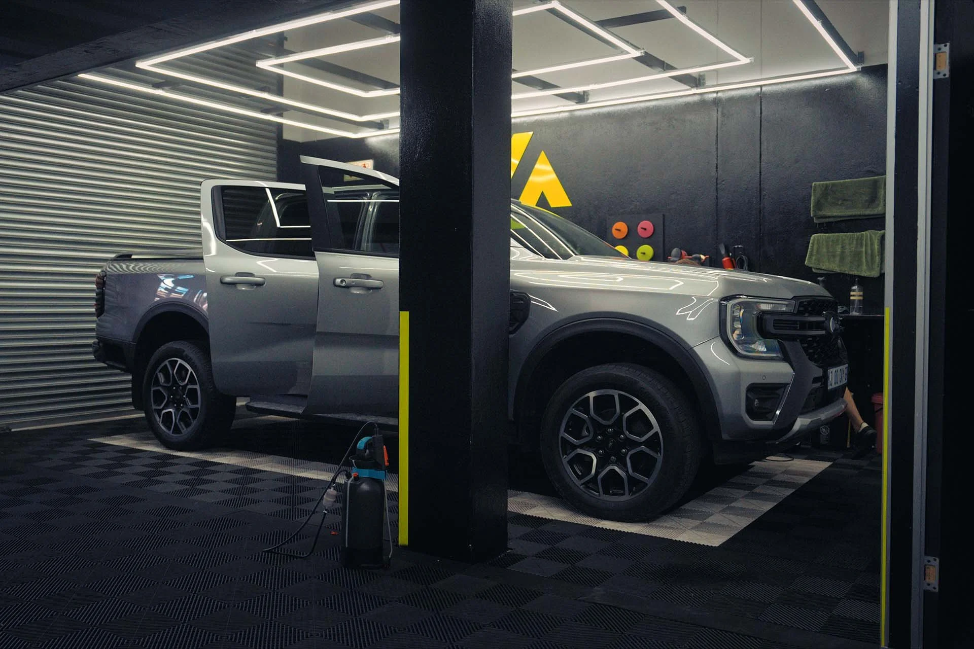Ford Ranger under LED lighting inside the Innovation Auto paint protection film workshop
